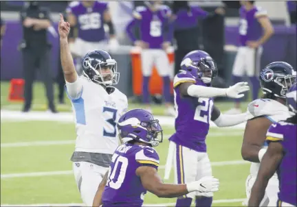  ?? THE ASSOCIATED PRESS ?? Tennessee Titans kicker Stephen Gostkowski (3) celebrates after kicking a 55-yard field goal during the second half of the team’s Sept. 27 game against the Viking in Minneapoli­s. The Titans have had two games reschedule­d since then because of of a COVID-19outbreak among their players.