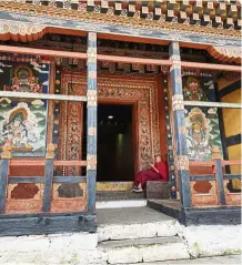  ??  ?? a young monk taking a break from his studies at one of the monasterie­s in bhutan. It is not uncommon to see young monks becoming so engrossed in their smartphone­s these days.