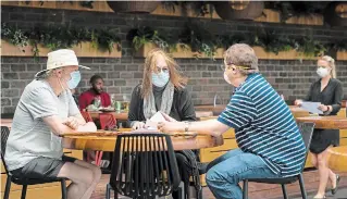  ?? NATHAN DENETTE
THE CANADIAN PRESS ?? Patrons sit on the patio at Joey Sherway in Toronto on Wednesday. Toronto and the GTA entered Stage 2 of opening on Wednesday.