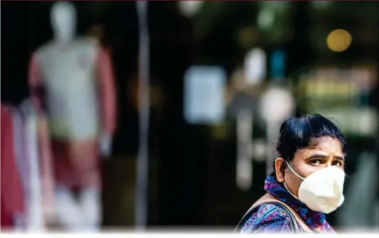  ?? Photo: AFP ?? A woman walks along a closed shopping mall area during a government-imposed nationwide lockdown to prevent the spread of COVID-19 in New Delhi, India on Tuesday.