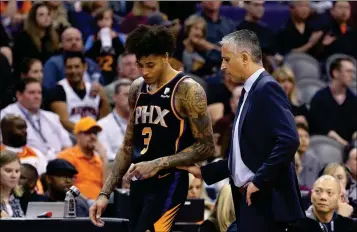  ?? ASSOCIATED PRESS ?? PHOENIX SUNS COACH IGOR KOKOSKOV (RIGHT) talks with forward Kelly Oubre Jr. (3) during the first half of the team’s game against the Atlanta Hawks on Saturday in Phoenix. The Hawks defeated the Suns 118-112.