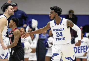  ?? MICHAEL WADE / ICON SPORTSWIRE ?? Georgia State senior guard Devin Mitchell exults during Saturday’s 83-70 win over Arkansas-Little Rock at GSU Sports Arena. “We’re brothers, so just being out there one last time, you definitely felt it,” he said.