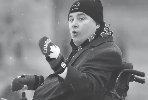  ?? JUSTIN TANG / THE CANADIAN PRESS ?? Disabiliti­es Minister Kent Hehr addresses the official inaugurati­on of the Canada 150 Rink on Parliament Hill on Thursday.