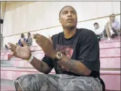  ?? MIKE MAPLE/THE COMMERCIAL APPEAL ?? Omar Sneed, who played at Memphis from 1997-99, cheers during the 13-and-under AAU national tournament Saturday. Sneed is back this weekend to watch his son, Jalen, compete.