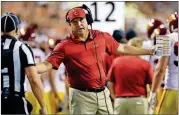  ?? [ERIC GAY/THE ASSOCIATED PRESS] ?? USC head coach Clay Helton speaks to an official during the first half against Texas on Saturday in Austin. The Trojans lost 37-16.