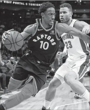  ?? AP PHOTO ?? Toronto Raptors guard DeMar DeRozan drives on Detroit Pistons forward Blake Griffin during the second half of an NBA game Wednesday night in Detroit.