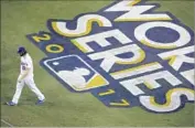  ?? Allen J. Schaben Los Angeles Times ?? CLAYTON KERSHAW, who pitched in relief Wednesday, walks off the field during Game 7.