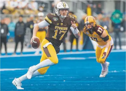  ?? Darin Oswald, Idaho Statesman ?? Wrapping up his Wyoming career Friday, QB Josh Allen completed 11-of-19 passes for 154 yards and three touchdowns against Central Michigan in the Famous Idaho Potato Bowl in Boise. Next stop for Allen: the 2018 NFL draft.