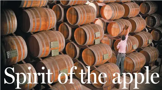  ?? PHOTOS PROVIDED TO CHINA DAILY ?? The ancient oak barrels are used to age the apple brandy, which the locals call calvados.