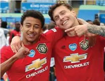  ??  ?? Lingard and Lindelof enjoy United’s 2-0 victory