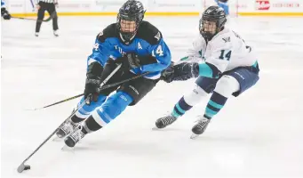  ?? ANDREW LAHODYNSKY­J/THE CANADIAN PRESS ?? Toronto's Renata Fast, left, says PWHL players are strong and fit enough to handle the more physical game that the new league's rules allow for. She says that responsibl­e body checking is “going to be great for the game and the entertainm­ent value.”