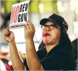  ??  ?? NOISE BARRAGE — A woman participat­es in a noise barrage at the Ninoy Aquino Monument in Marikina City Tuesday night to oppose any plan by the Duterte administra­tion to set up a revolution­ary government. (Rio Leonelle Deluvio)