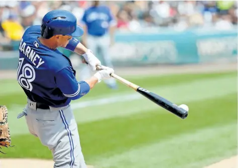  ?? JON DURR/GETTY IMAGES ?? Toronto Blue Jays’ Darwin Barney hits a single against the Chicago White Sox during the fifth inning at Guaranteed Rate Field on Wednesday, in Chicago.