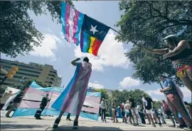  ?? Eric Gay Associated Press ?? PROTESTERS RALLY last year at the Texas Capitol against transgende­rrelated bills. A Texas ruling lets the state investigat­e parents of trans children.