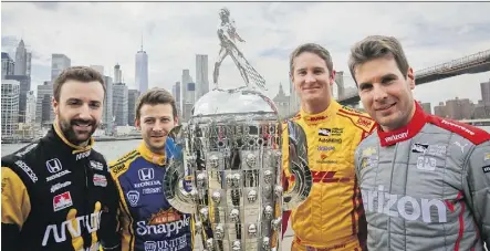  ?? BEBETO MATTHEWS/THE ASSOCIATED PRESS ?? Indy 500 race car drivers, from left, James Hinchcliff­e, Marco Andretti, Ryan Hunter-Reay and Will Power show off the Borg-Warner race trophy, Tuesday. They will race for it Sunday.