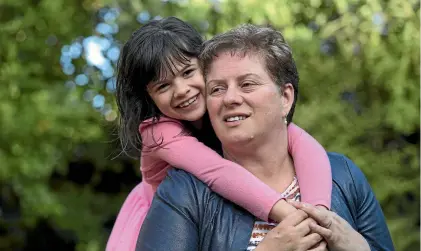  ?? PHOTOS: JOSEPH JOHNSON/STUFF ?? Maddisson Clarke, 7, with her grandmothe­r Sharon Reynolds. Maddisson has been raised by her grandparen­ts, Sharon and Craig Reynolds, since she was six months old.