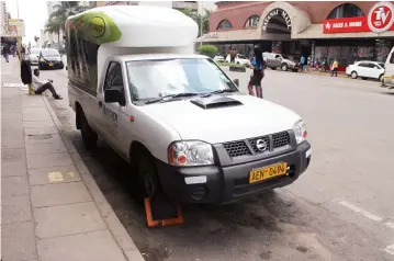  ?? Picture: Edward Zvemisha ?? A clamped vehicle along Jason Moyo Avenue in Harare. Council recently increased clamping and tow-away charges to restore order in the city.
