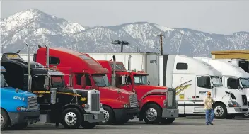  ?? DAVID McNEW/GETTY IMAGES ?? More transport trucks on our roads means more greenhouse gas emissions.