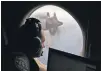  ?? ROB GRIFFITH, AP ?? Flight officer Rayan Gharazeddi­ne scans the water in the southern Indian Ocean off Australia during a search March 22, 2014.