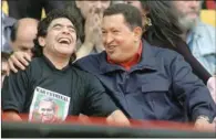  ?? (AFP) ?? In this file photo taken on November 04, 2005 Venezuelan President Hugo Chavez jokes with Diego Maradona in Mar del Plata, Argentina.