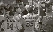  ?? Sean M. Haffey / Getty Images ?? Justin Verlander gets a big welcome as his night ends.