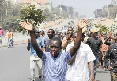  ?? PICTURE: AP ?? PROTEST: Supporters of opposition leader Raila Odinga demonstrat­e anti-IEBC at Ngong Road in Nairobi, Kenya, on Tuesday.