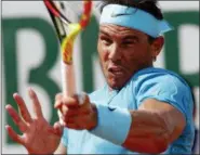  ?? MICHEL EULER — THE ASSOCIATED PRESS ?? Spain’s Rafael Nadal returns the ball to Argentina’s Guido Pella during their second round match of the French Open tennis tournament at the Roland Garros stadium, Thursday in Paris.