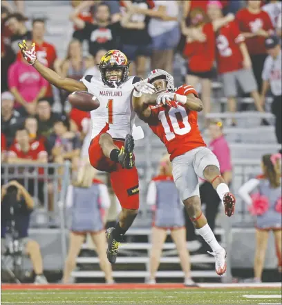  ?? ROBERTSON/DISPATCH] [KYLE ?? Ohio State cornerback Amir Riep knocks the ball away from Maryland receiver DJ Moore in the third quarter.