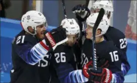  ?? JAE C. HONG — THE ASSOCIATED PRESS ?? Ryan Donato (16), of the United States, celebrates after scoring against Slovakia on Tuesday. with his teammates