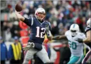  ?? MICHAEL DWYER — THE ASSOCIATED PRESS ?? New England Patriots quarterbac­k Tom Brady passes under pressure from Miami Dolphins defensive end Andre Branch (50) during the first half of an NFL football game, Sunday in Foxborough, Mass.