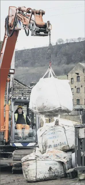  ?? PICTURE: PA ?? PREPARATIO­N: Workers construct flood defences in Mytholmroy­d, West Yorkshire, ahead of Storm Dennis. Residents will be hoping there won’t be a repeat of last week’s floods when Storm Ciara hit.