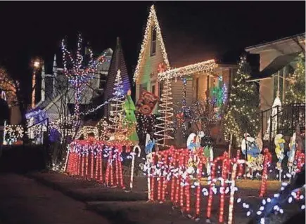  ?? RICK WOOD, MILWAUKEE JOURNAL SENTINEL ?? Candy Cane Lane’s holiday displays open Nov. 23 in West Allis. Money raised goes to Midwest Athletes Against Childhood Cancer.