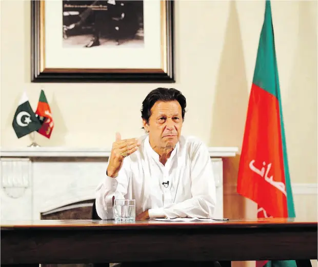  ?? TEHREEK-E-INSAF PARTY VIA THE ASSOCIATED PRESS ?? Pakistani politician and former cricket star Imran Khan, head of the Tehreek-e-Insaf party, delivers an address in Islamabad Thursday where he declared victory in the general election, promising a “new” Pakistan following a vote that was marred by...