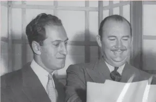  ?? United Press Internatio­nal 1932 ?? George Gershwin (left) in 1932 with bandleader Paul Whiteman, who conceived the event for which “Rhapsody in Blue” was written.