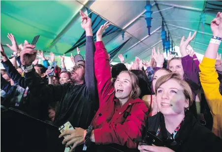  ?? DARREN STONE, TIMES COLONIST ?? Fans watch SonReal perform in the Rifftop Tent during Rifflandia at Royal Athletic Park on Friday night. The festival continues today and Sunday with more than 160 acts at various venues, including Phillips Backyard and Capital Ballroom.