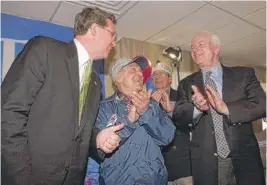  ?? SUN-TIMES FILE ?? Then-U.S. Senate candidate Jim Durkin (left) receives an endorsemen­t from Sen. John McCain (right) in 2002 at an event at O’Connor’s Deli &amp; Market, 7280 W. Devon.