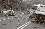  ?? Doug Walker /
Rome News-Tribune ?? Debris is strewn across Rockmart Highway on May 20 after a three-car wreck sent four people to area hospitals.