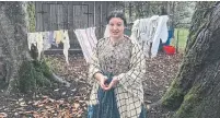  ?? LORI RACKL/TRIBUNE NEWS SERVICE ?? Tour leader Cassie Whitlock, dressed in period garb, talks about 19th-century life at Philip Foster Farm in Eagle Creek, Ore.
