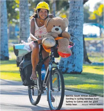  ?? Picture: WESLEY MONTS ?? MATES: South African Adeena Gerding is cycling barefoot from Sydney to Cairns with her giant teddy bear.