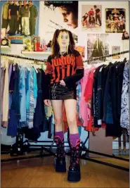  ?? (The New York Times/Luisa Opalesky) ?? Emma Rogue stands inside her Lower East Side vintage shop, Rogue, in New York. The clothing seller is building a vibrant and eclectic community of TikTok style stars, D.I.Y. designers and vintage fanatics.