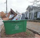  ?? HEIDI HEILBRUNN/FILE ?? Curbside recycling helps increase the rate of recycling in cities such as Greenville.