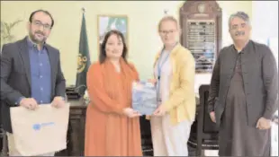  ?? -APP ?? ISLAMABAD
Coordinato­r to PM on climate change Romina Khurshid Alam being presented a book on safeguardi­ng Indus river vitality by Indus river team.