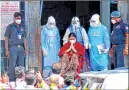  ?? –AFP ?? Expelled AIADMK leader VK Sasikala (C) gestures after she was discharged from the Victoria Hospital in Bangalore on Sunday.