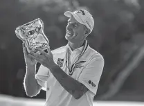  ?? Z Long / Associated Press ?? Jim Furyk with the trophy after Sunday’s U.S. Senior Open. He is the eighth player to win both the U.S. Open and Senior Open.