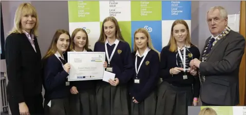  ??  ?? BEST SOCIAL MEDIA: ‘Element Events’ from East Glendaloug­h School collect their award from Sheelagh Daly from the LEO and Cllr Pat Fitzgerald, cathaoirle­ach of Wicklow County Council.