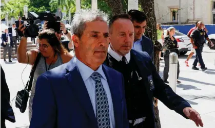  ?? Photograph: Marco Bello/Reuters ?? Carlos De Oliveira, the property manager of Donald Trump's Mar-a-Lago estate, leaves the federal court in Miami, Florida, on Monday.