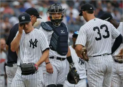  ?? THE ASSOCIATED PRESS ?? Yankees starting pitcher Sonny Gray, left, leaves the mound as he is relieved during the third inning of Wednesday’s game against the Orioles in New York.