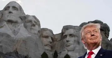  ??  ?? STONY-FACED: Donald Trump at Mount Rushmore in South Dakota. Photo: Alex Brandon/AP
