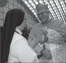  ?? AP Photo/Alessandra Tarantino ?? Congratula­tions: New Cardinal Thomas Aquinas Manyo, Archbishop of Osaka, is congratula­ted by a nun after a consistory at the Vatican, Thursday, June 28, 2018. Pope Francis made 14 new Cardinals during the consistory.