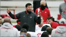  ?? ASSOCIATED PRESS FILE PHOTO ?? Ohio State head coach Ryan Day talks to his team during their Oct. 3 practice in Columbus, Ohio.